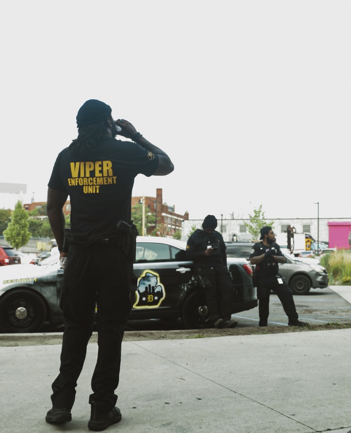 Detroit Body Guards Viper Enforcement Unit officer with branded patrol vehicle